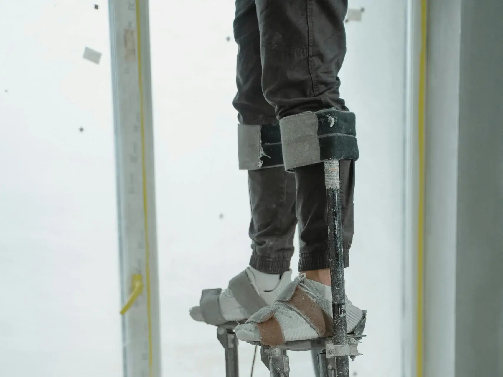 Construction worker finishing drywall